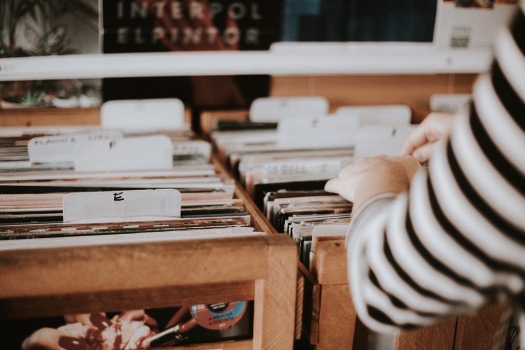 girl searching through vinyl records