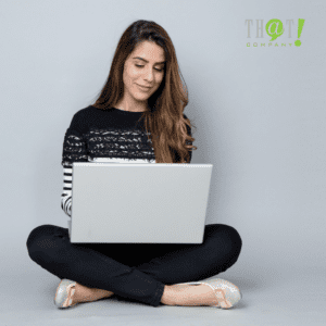 Achieving Success | A Girl Sitting On The Floor Browsing On A Laptop